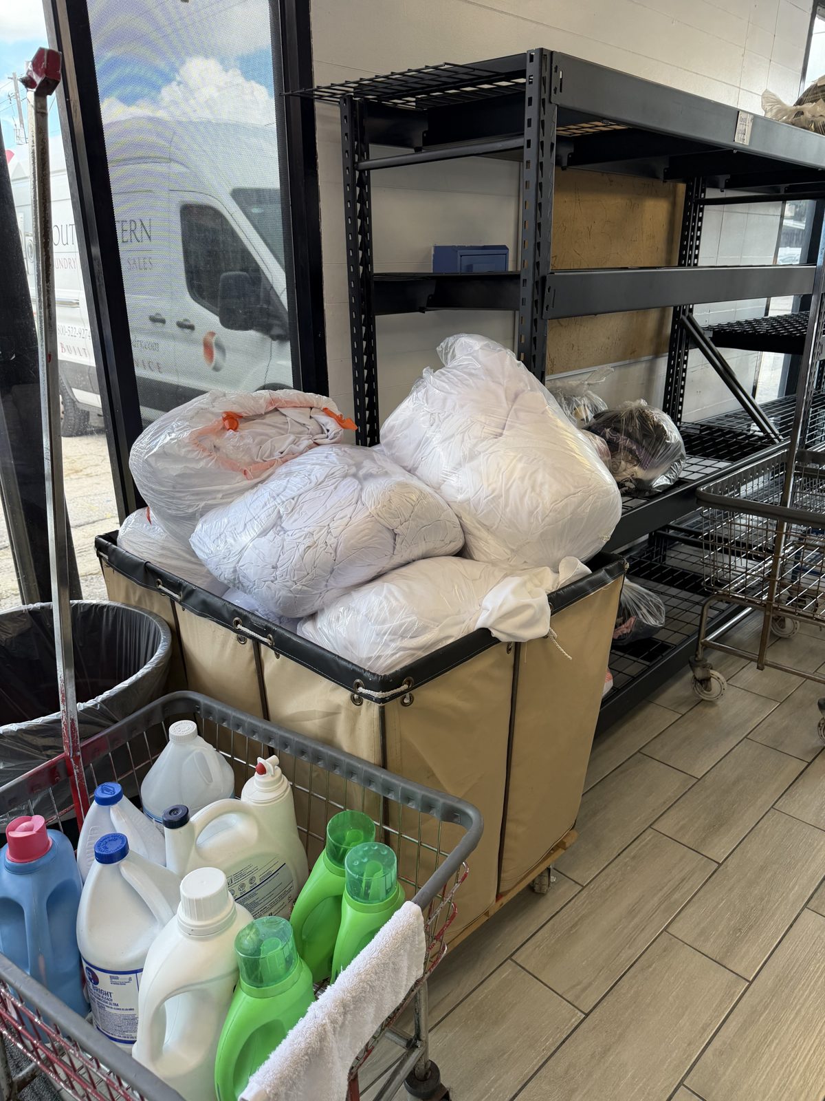 Pickup and delivery bags in a cart at the Ebanks laundromat