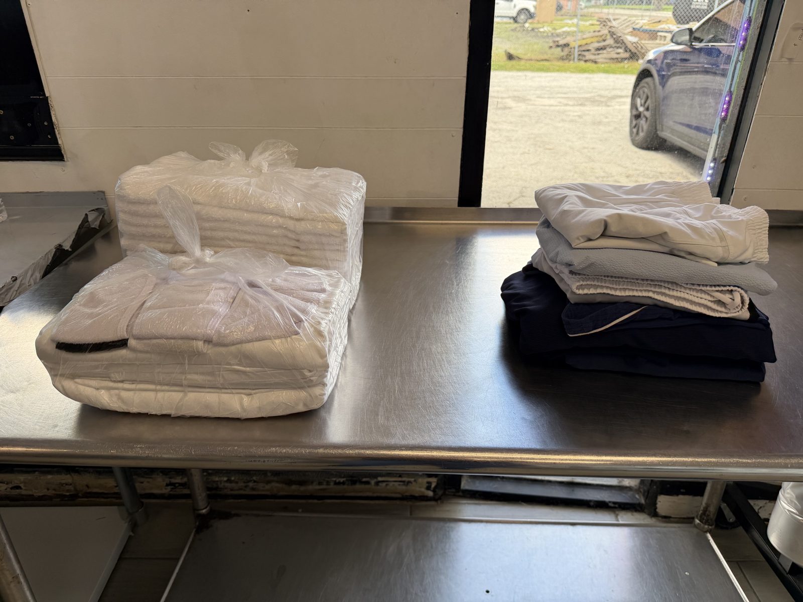 Finished, bagged wash and fold orders on the folding table